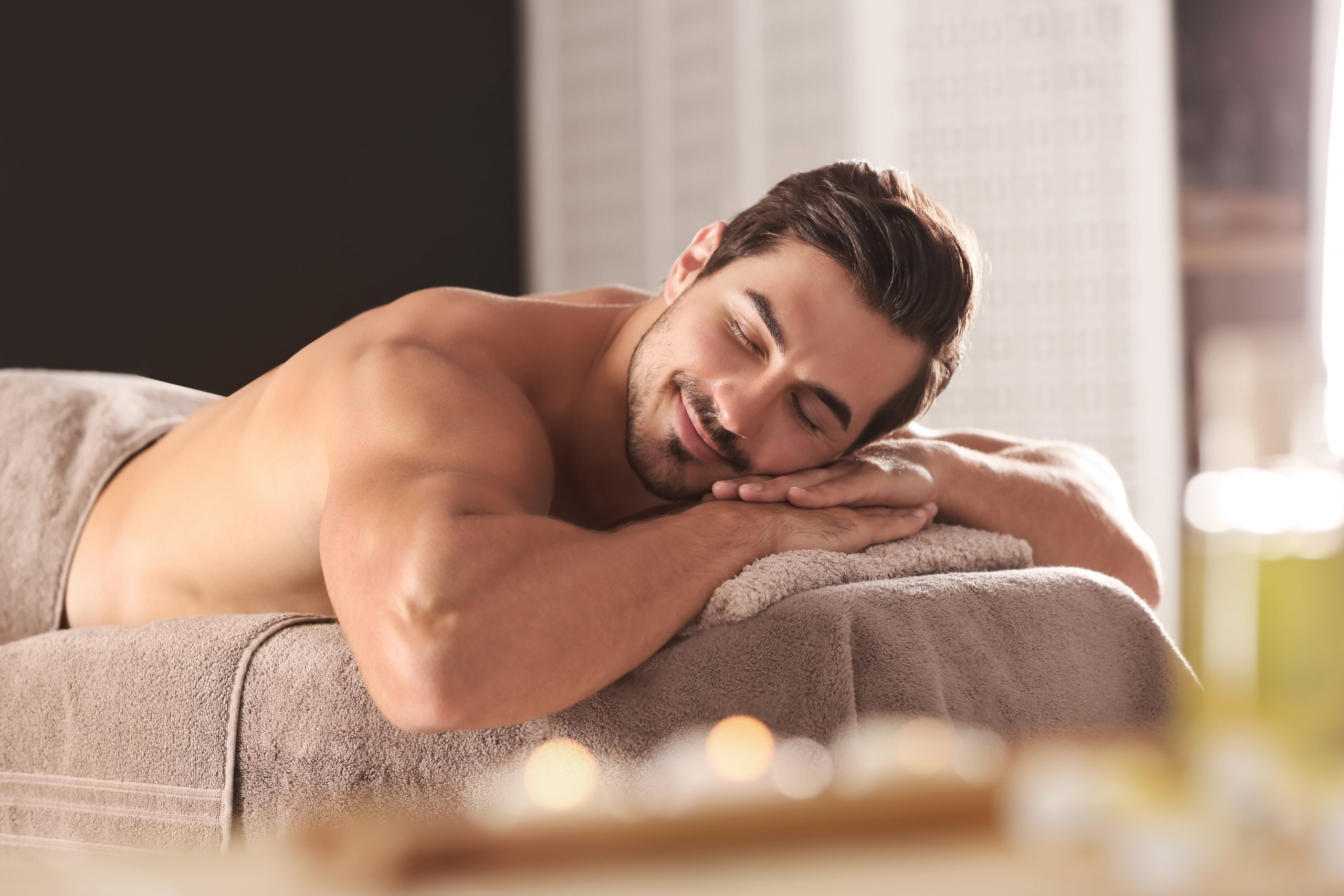 smiling man at massage parlor