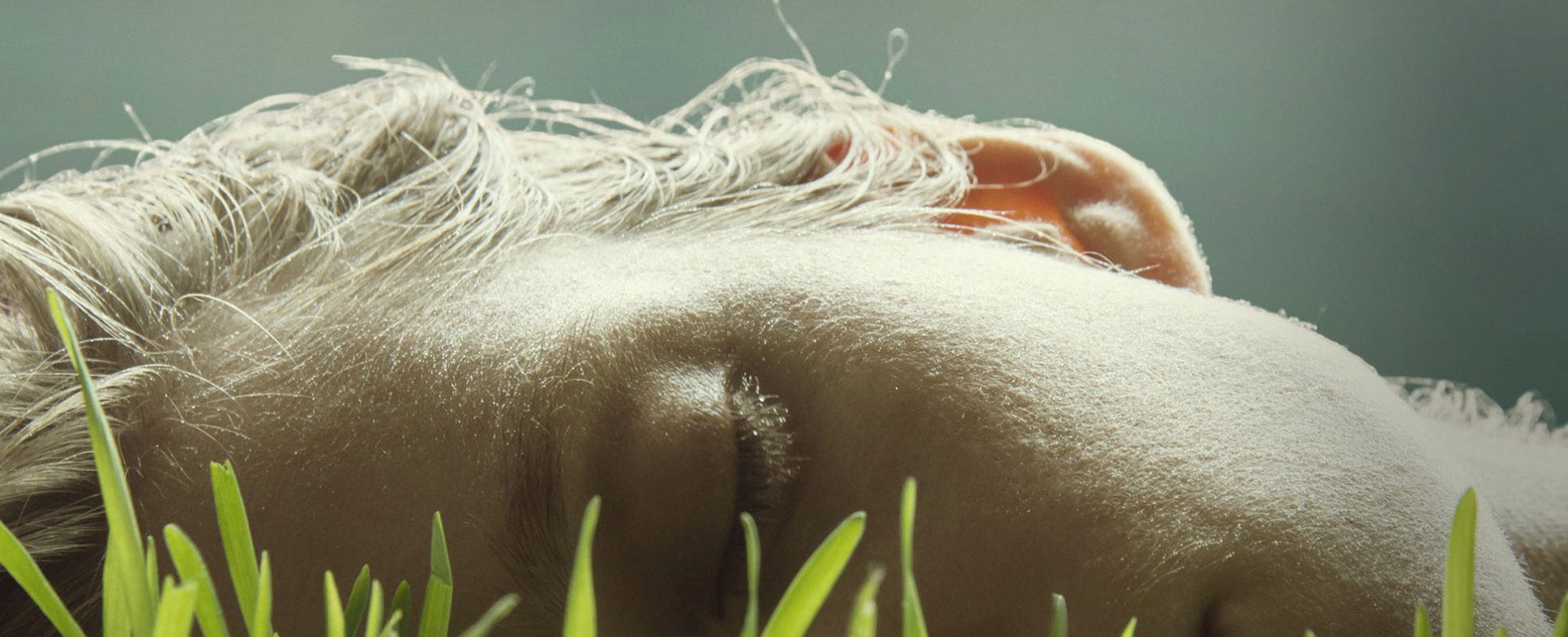 artistic picture of boy laying on side