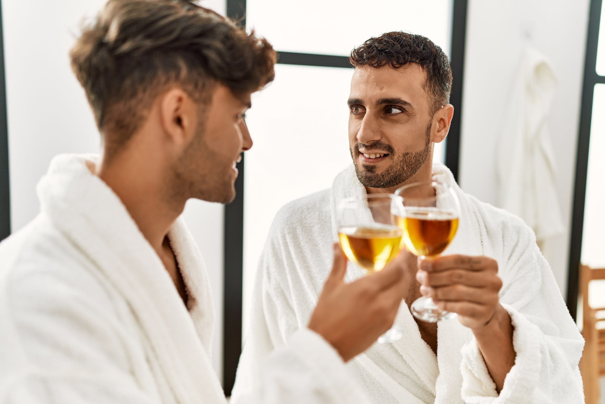 two guys say cheers